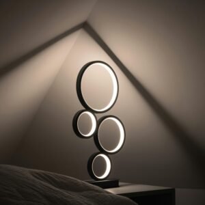 Elegant minimalist lamp with circular design, casting soft light in a dim, modern room.